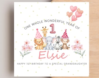 May include: A square birthday card featuring watercolour illustrations of a lion, giraffe, elephant, zebra, and monkey wearing party hats. Text reads: ONE WHOLE WONDERFUL YEAR OF 1 Elsie HAPPY 1ST BIRTHDAY TO A SPECIAL GRANDDAUGHTER with pink hearts.