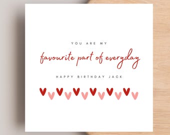 May include: A white greeting card with red and pink hearts at the bottom. The card has the text "YOU ARE MY favourite part of everyday" in red script, and "HAPPY BIRTHDAY JACK" in black.