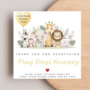 May include: A square card featuring a watercolour illustration of cartoon animals, including a zebra, monkey, elephant, giraffe, lion, and hippo. The card has text that reads "Thank You For Everything" and "Play Days Nursery."