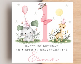 May include: A pink and white birthday card with a pink number one, an elephant, a giraffe, and a butterfly. The card says "Happy 1st Birthday to a special granddaughter Esme".