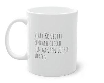 May include: White ceramic mug with black text that reads "STATT KONFETTI EINFACH GLEICH DEN GANZEN LOCHER WERFEN."