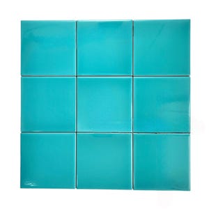 May include: Nine turquoise square ceramic tiles arranged in a 3x3 grid.