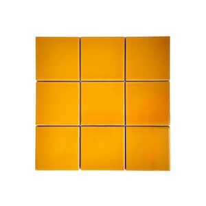 May include: Nine square ceramic tiles in a vibrant, glossy yellow hue. The tiles are arranged in a grid pattern, each with a smooth, reflective surface. The tiles are a solid colour, with no visible patterns or designs.