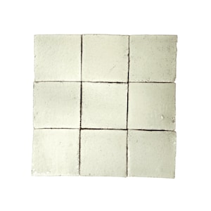 May include: Nine off-white square ceramic tiles arranged in a 3x3 grid. The tiles have a slightly textured surface and are separated by thin black lines.