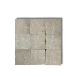 May include: Nine square, light grey tiles arranged in a 3x3 grid. Each tile has a slightly textured surface and a muted, neutral colour. The tiles are evenly spaced and appear to be made of stone or a similar material, suitable for flooring or wall applications.