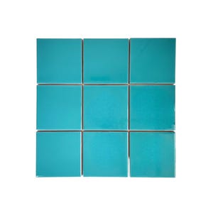 May include: Nine square, turquoise-colored tiles arranged in a grid pattern. The tiles have a glossy finish and are evenly spaced, creating a clean and modern aesthetic. The tiles are a vibrant shade of blue-green.
