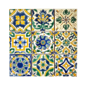 May include: Nine square ceramic tiles with detailed floral patterns in blue, yellow, and green on a white backdrop. Each tile showcases a distinct design, offering a visually varied and decorative display. The tiles are arranged in a 3x3 grid.