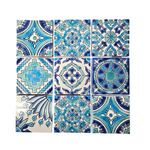 May include: Nine square ceramic tiles with blue and white geometric patterns. The tiles are arranged in a 3x3 grid.