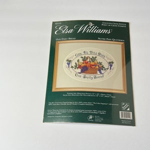 May include: A counted cross stitch pattern featuring a basket of fruit with the text "Give Us This Day Our Daily Bread". The pattern is by Elsa Williams and is designed for 14 count Aida fabric.