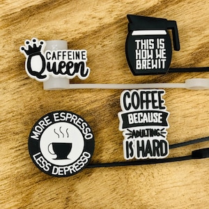 May include: Four black and white coffee-themed charms with sayings: "Caffeine Queen", "This is How We Brew It", "More Espresso Less Depresso", and "Coffee Because Adulting is Hard".