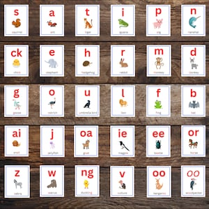 May include: A set of 26 colorful flashcards featuring different animals and their corresponding letter sounds. Each card has a white background with a blue and red border. The letters are in red and the animal names are in black.