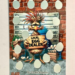 May include: A novelty scratch-off card featuring a cartoon chicken holding a sign that reads "Local Egg Dealer." The card has a brick background and several scratch-off egg shapes. The text "The Humble Budgeter" is at the bottom.