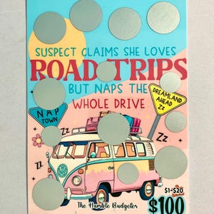 May include: A colorful scratch-off card with a pink and blue van illustration. Text reads "Suspect claims she loves road trips but naps the whole drive." Includes "Nap Town" and "Dreamland Ahead" signs, plus a $100 prize.