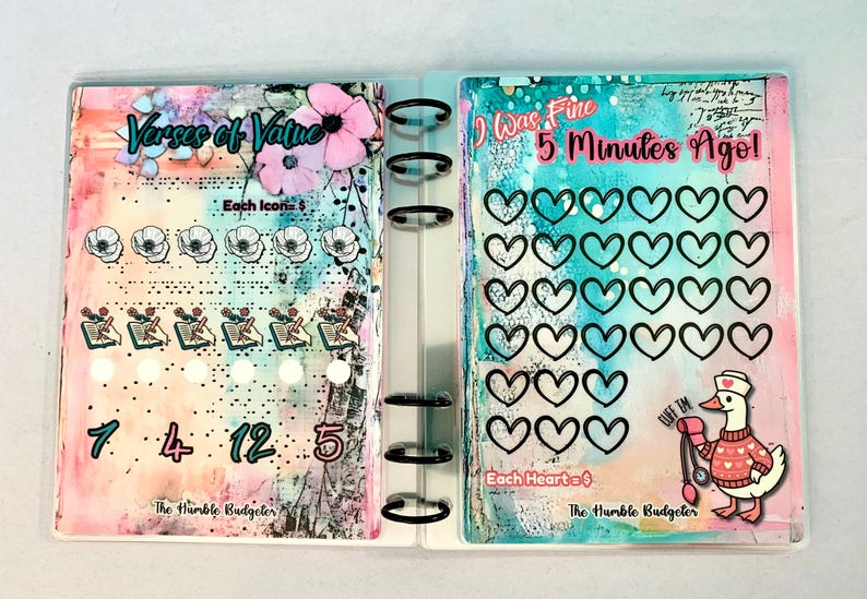May include: A planner with colorful watercolor backgrounds and text that reads "Verses of Value" and "I Was Fine 5 Minutes Ago!". The planner includes heart and flower icons, numbers, and a cartoon duck with a stethoscope.