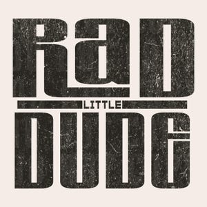 May include: Black and white graphic design with the text "Little Rad Dude" in a distressed font.