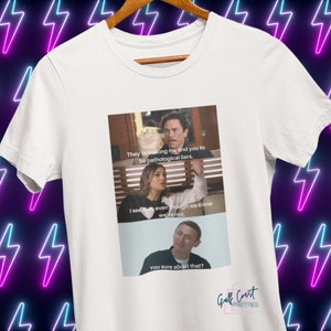 May include: White t-shirt featuring a meme with three panels and text. The top panel reads "They're making me and you to be pathological liars." The middle panel says "I said it, even though we know we're not." The bottom panel reads "You sure about that?"