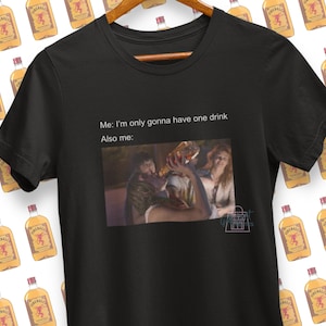 May include: Black t-shirt with a meme about drinking. The text reads "Me: I'm only gonna have one drink. Also me:" and features a photo of a person holding a glass of wine.
