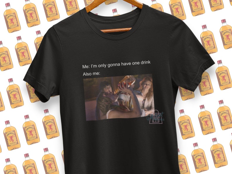 May include: Black t-shirt with a meme about drinking. The text reads "Me: I'm only gonna have one drink. Also me:" and features a photo of a person holding a glass of wine.