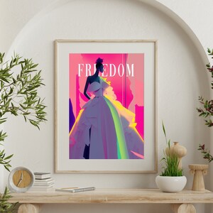 May include: A framed poster with a colorful illustration of a woman in a white dress. The text "FREEDOM" is printed in bold letters at the top of the poster.