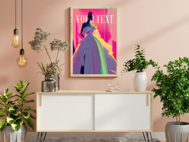 May include: A framed poster with a colorful abstract design featuring a woman in a white dress. The poster is hanging on a light pink wall above a white cabinet with wooden accents.