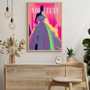 May include: A framed poster with a pink, purple, and yellow background featuring a woman in a white dress with the text "YOUR TEXT" in white.