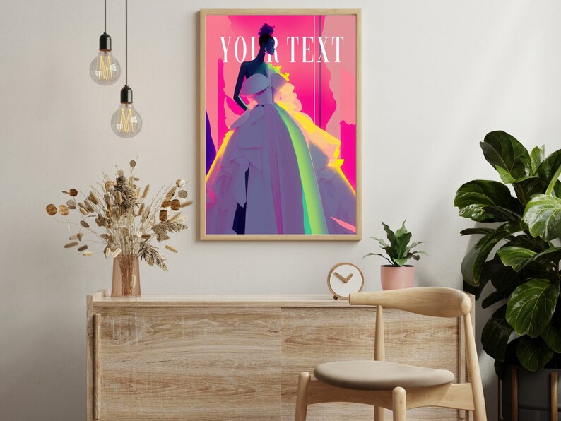 May include: A framed poster with a pink, purple, and yellow background featuring a woman in a white dress with the text "YOUR TEXT" in white.