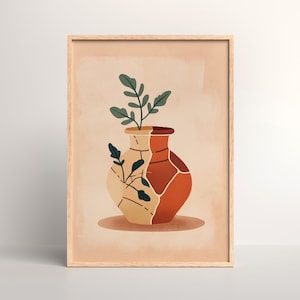 Puede incluir: Una impresión artística enmarcada que presenta una ilustración estilizada de un jarrón con un diseño agrietado. El jarrón está dividido en secciones beige y marrón rojizo, con tallos de plantas verdes que emergen de la parte superior. El fondo es de color melocotón suave.