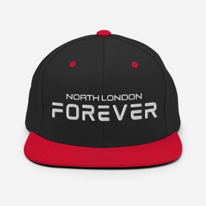 May include: Black and red baseball cap with the text "NORTH LONDON FOREVER" embroidered in white.