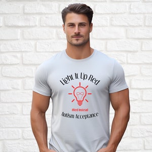 May include: A light gray t-shirt with a black graphic of a light bulb with the text "Light it Up Red #RedInstead Autism Acceptance".
