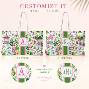 May include: White tote bag with a colourful floral and pagoda design, featuring a pink and green stripe down the centre. The bag is customisable with one or three initials. The text "Customize It, Make It Yours" is at the top.