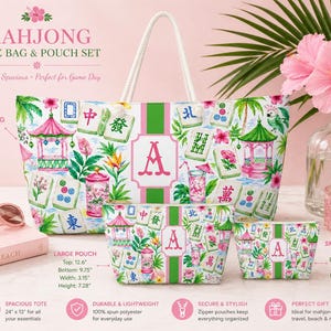 May include: A Mahjong tote bag and pouch set with a floral and pagoda design. The tote bag is 61cm x 33cm, and the set includes a large and small pouch. The set features a white rope handle and a pink and green colour scheme.