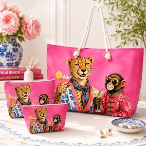 May include: A large pink tote bag and two smaller matching pouches featuring a graphic print of a cheetah and a monkey wearing colourful patterned clothing and holding cocktails. The bags have white rope handles and a vibrant fuchsia background.