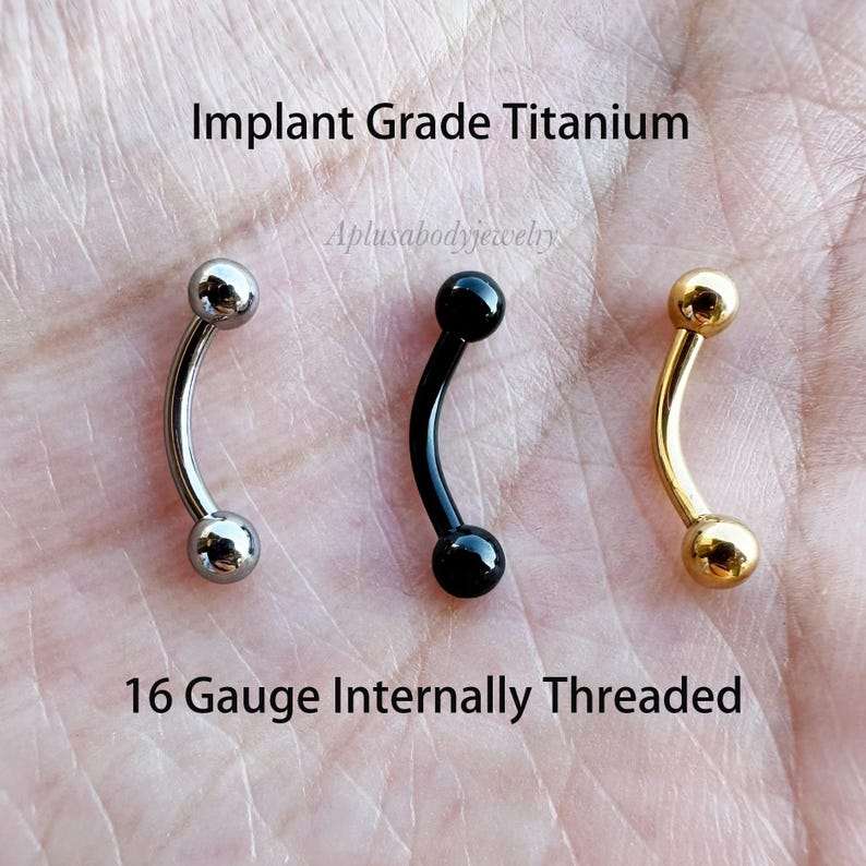 May include: Three 16 gauge internally threaded curved barbell body jewelry pieces. One is silver, one is black, and one is gold.