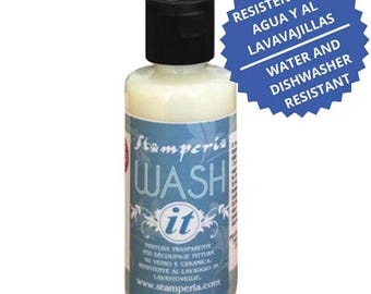May include: A bottle of "Stampéria Wash it" paint with a black cap. The label includes text in multiple languages, including "Water and Dishwasher Resistant". The bottle contains a creamy, off-white liquid.