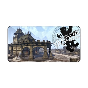 May include: A fantasy-themed gaming mouse mat featuring a stone building with arched doorways and a snowy landscape. The mouse mat has a circular logo with a lion and the text "Our Blood Runs Blue. Join the Honor for Excellence.  Vanquis. Aleswell - Ash - Dragonclaw - Glade".