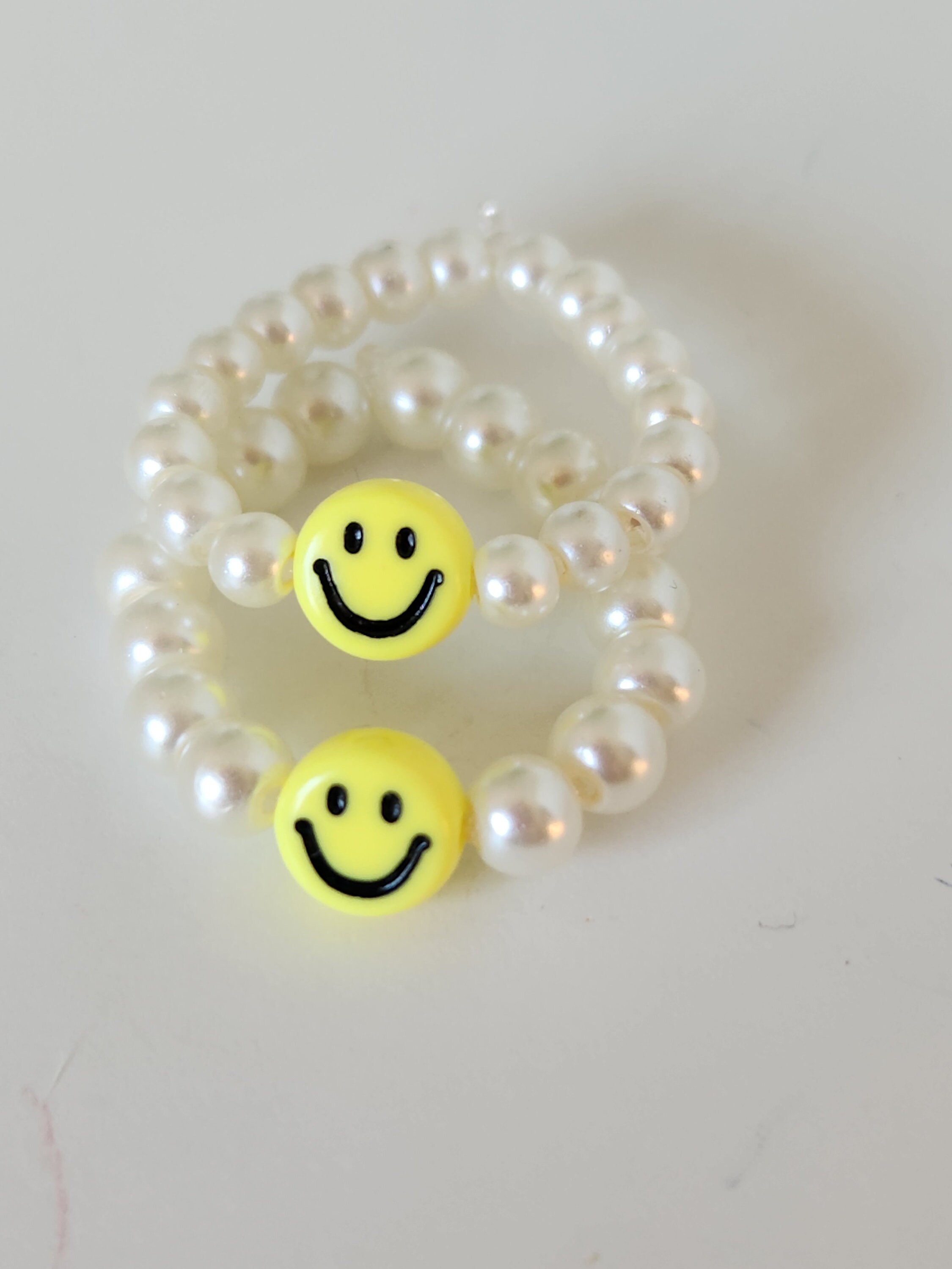 Smiley face pearl rings