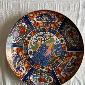 Vintage Elegance Authentic Moroccan Taous Plate Limited edition Rare find Moroccan Taous Tribute: Vintage Peacock-Inspired Porcelain Plate