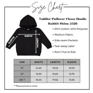 May include: Size chart for a toddler pullover fleece hoodie in black. The chart shows measurements in inches for width, length, and sleeve length for sizes 2T, 4T, and 5/6T. The hoodie is made of 60% cotton and 40% polyester, has side-seam pockets, a tear-away label, and runs true to size.