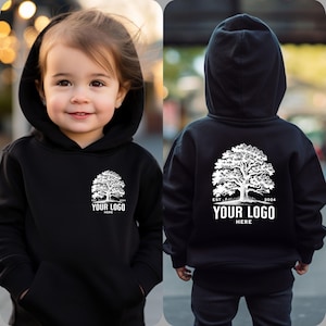 May include: Black hooded sweatshirt with a white tree and the text "EST. 2024 YOUR LOGO HERE" on the back. The front of the sweatshirt has a smaller version of the tree and text.