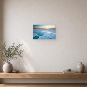 Frozen Salt Flats at Sunset - Canvas Wall Art shown as canvas wall art in a minimal shelf mockup