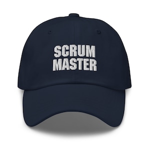 May include: A navy blue baseball cap with white embroidered text that reads "SCRUM MASTER".
