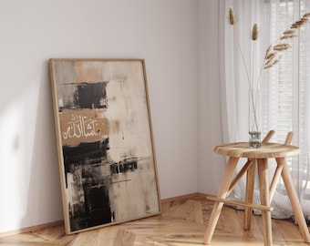 May include: A framed abstract painting with black, white, and beige brushstrokes. The Arabic word "Allah" is written in gold calligraphy on the painting.