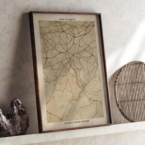 May include: A framed map print of Dalkeith, United Kingdom, with a network of brown lines on a beige background. The frame is dark brown. The text "65.8891° N, 3.0666° W" and "DALKEITH, UNITED KINGDOM" are visible.