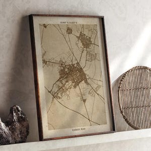 May include: A white ceramic mug with a black handle and the text "But First, Coffee" in a black, bold font. The mug is on a white surface. The mug is approximately 4 inches tall.