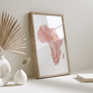 Impresión artística de pared en color rosa y dorado con el mapa de África