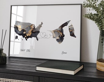 May include: A framed print with a black and white watercolor map of the United States and Brunei connected by a line with hearts. The text "United States" and "Brunei" are written below the maps.