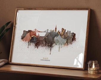 May include: A framed art print featuring a watercolor depiction of the Bristol, United Kingdom skyline. The artwork uses a palette of brown, gold, and gray tones, with a bridge and buildings silhouetted against a white background. The text "Bristol United Kingdom" is at the bottom.