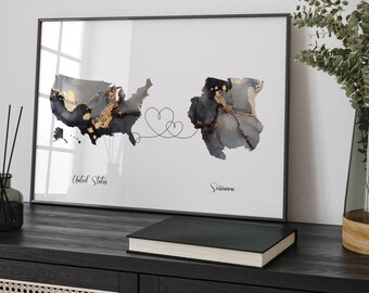 May include: A black and white map print with gold accents showing the United States and Suriname connected by a line with two hearts. The text "United States" and "Suriname" are below the maps.