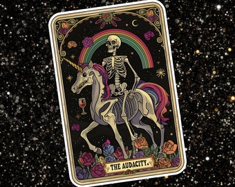 May include: A tarot card with a skeleton riding a unicorn. The card is set against a black background with a rainbow and stars. The card is titled "The Audacity."