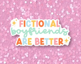 May include: A pink glitter background with a white sticker that says "Fictional boyfriends are better" in colorful letters.